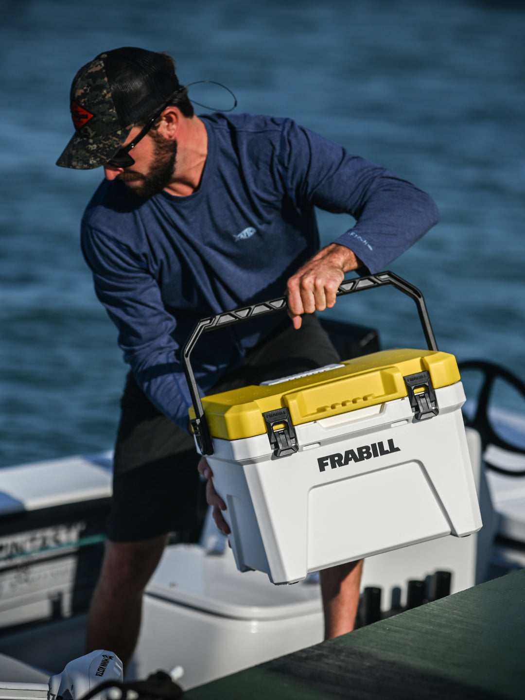 Guy carrying a Magnum bait station